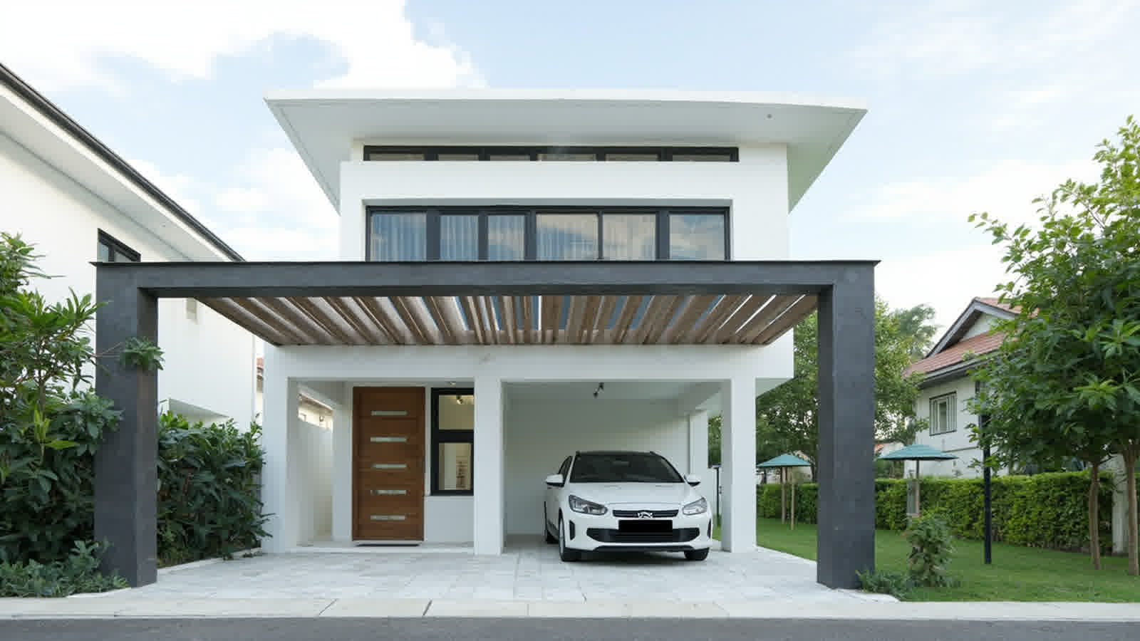 Kanopi Garasi dengan struktur baja ringan dan atap spandeck terpasang di area parkir kendaraan rumah tinggal di Indonesia.